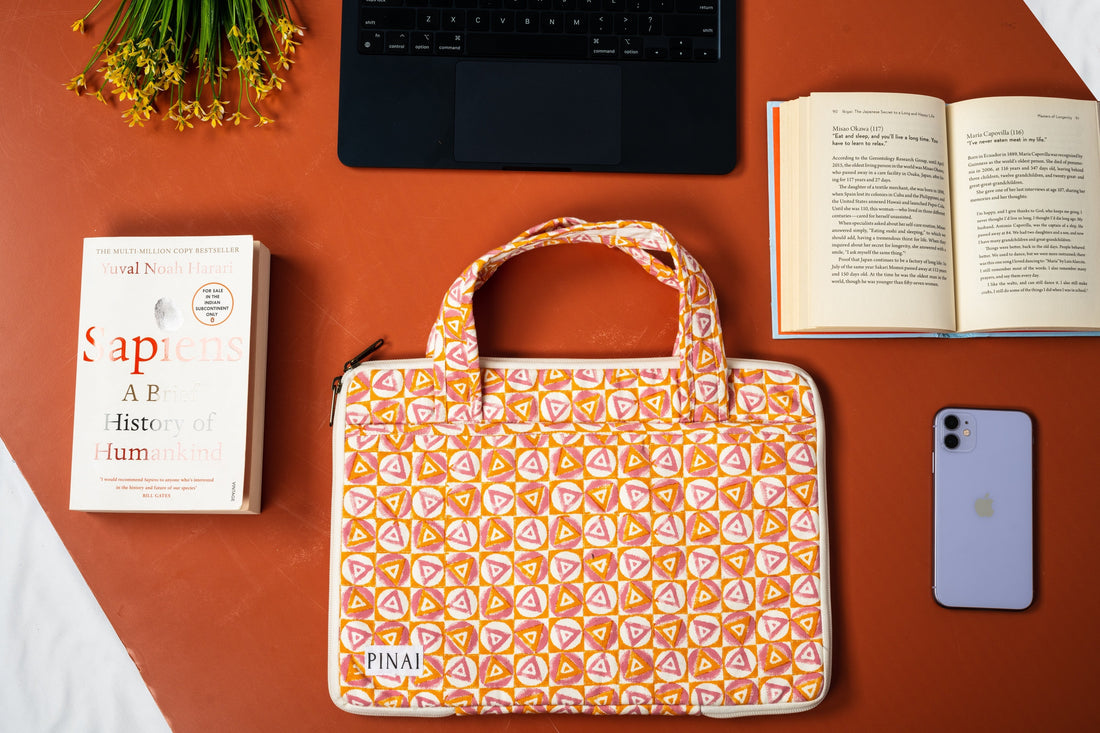 desk with laptop and laptop sleeve